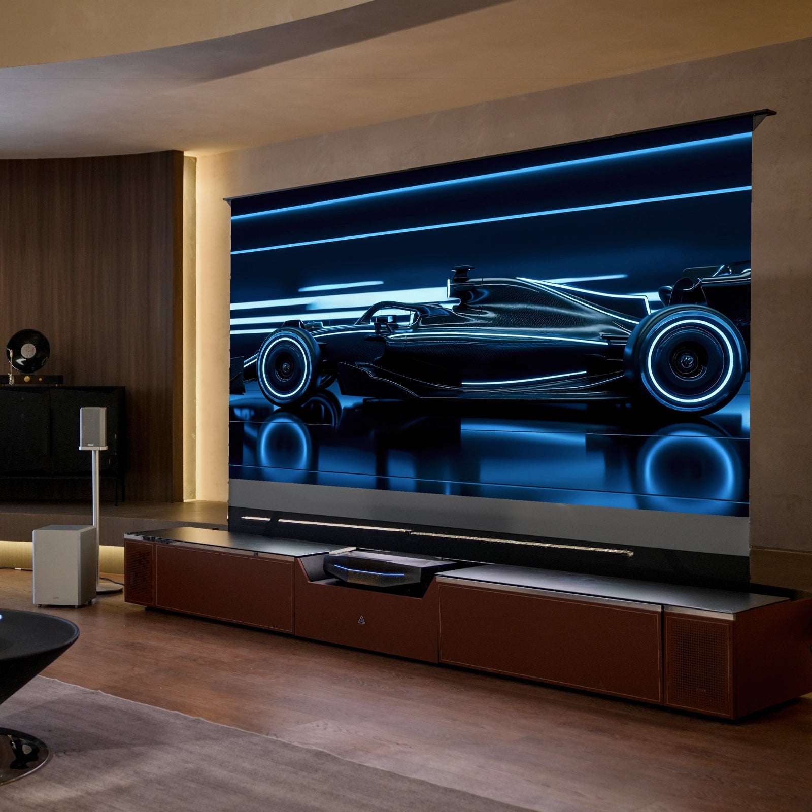 AWOL Vision New Gen Vanish TV Cabinet in a premium home theater with a floor-rising screen and integrated UST projector system.